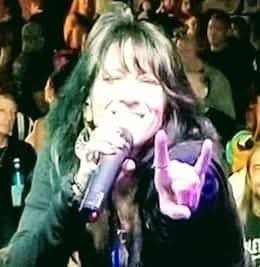 Angie Campbell throwing the horns in the crowd